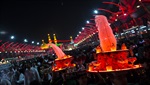 Hussainian processions and free-service booths offer pilgrims flowers and sweets